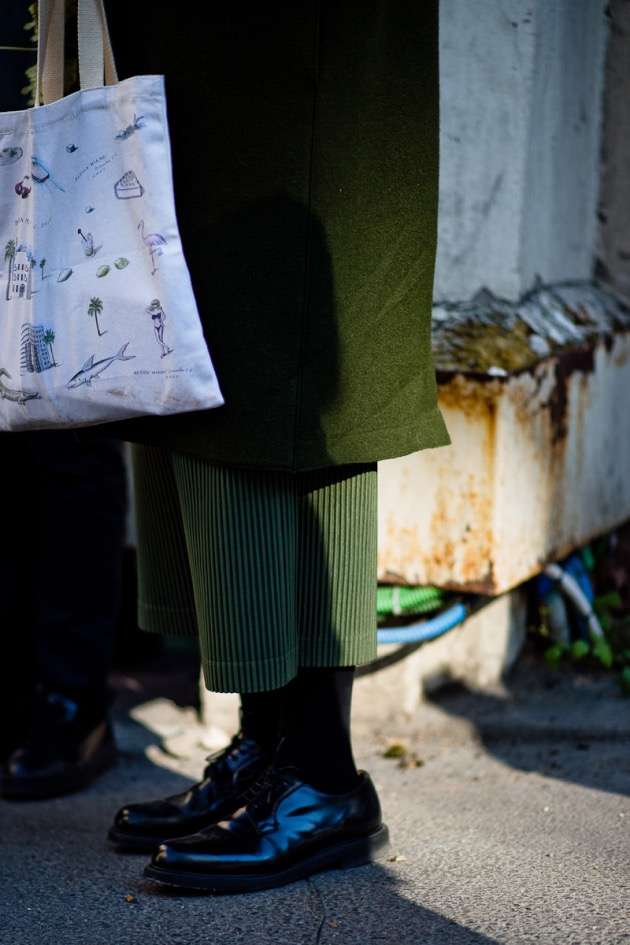Street style photo of men wearing directional fashion